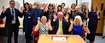 Healthcare trust commits to improving access for Deaf people